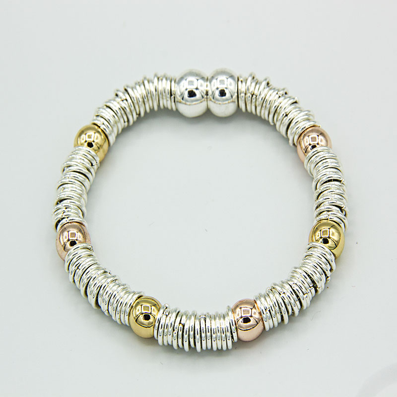 silver bracelet with rose gold balls